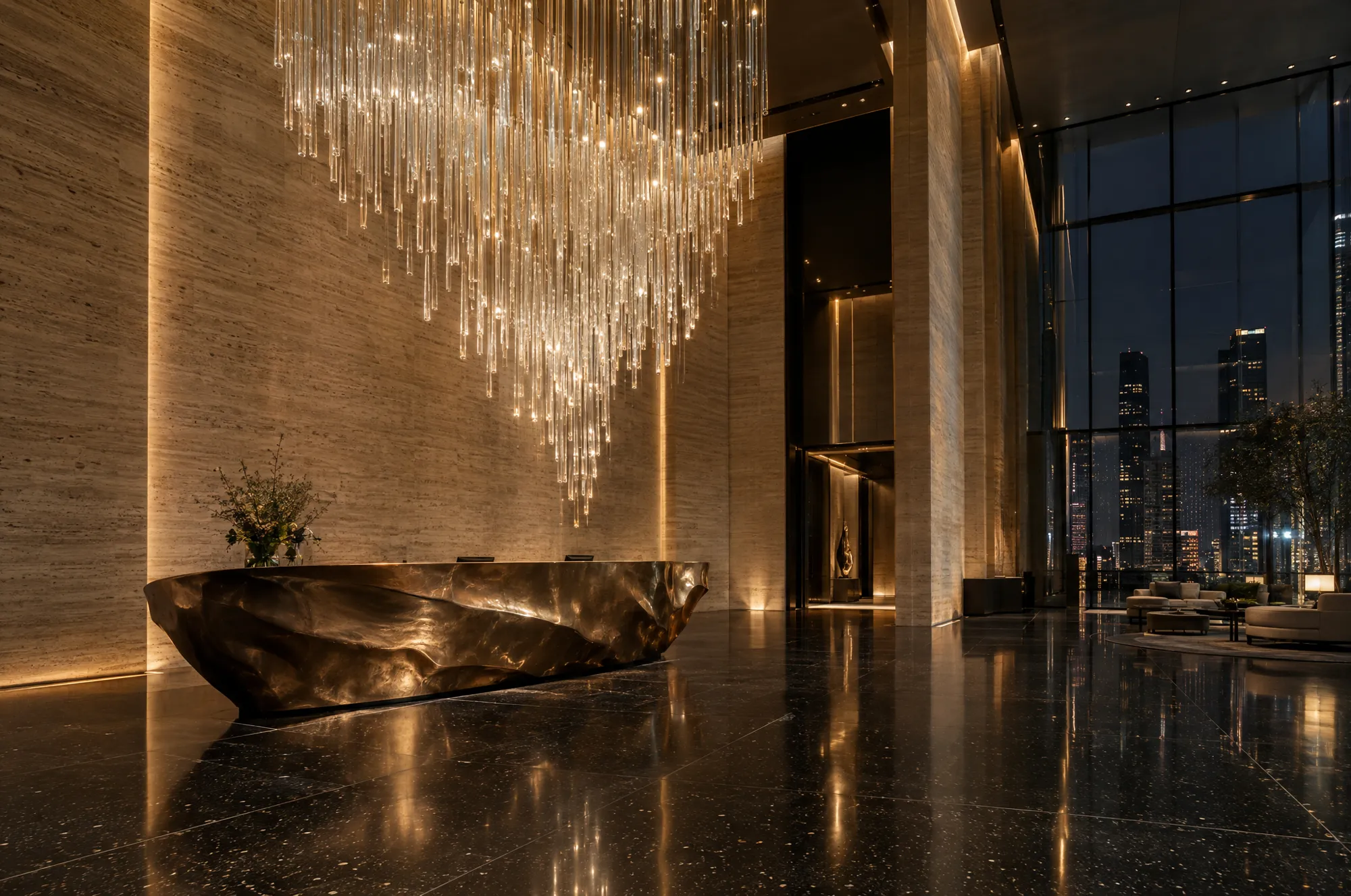 Double-height travertine lobby with crystal chandelier